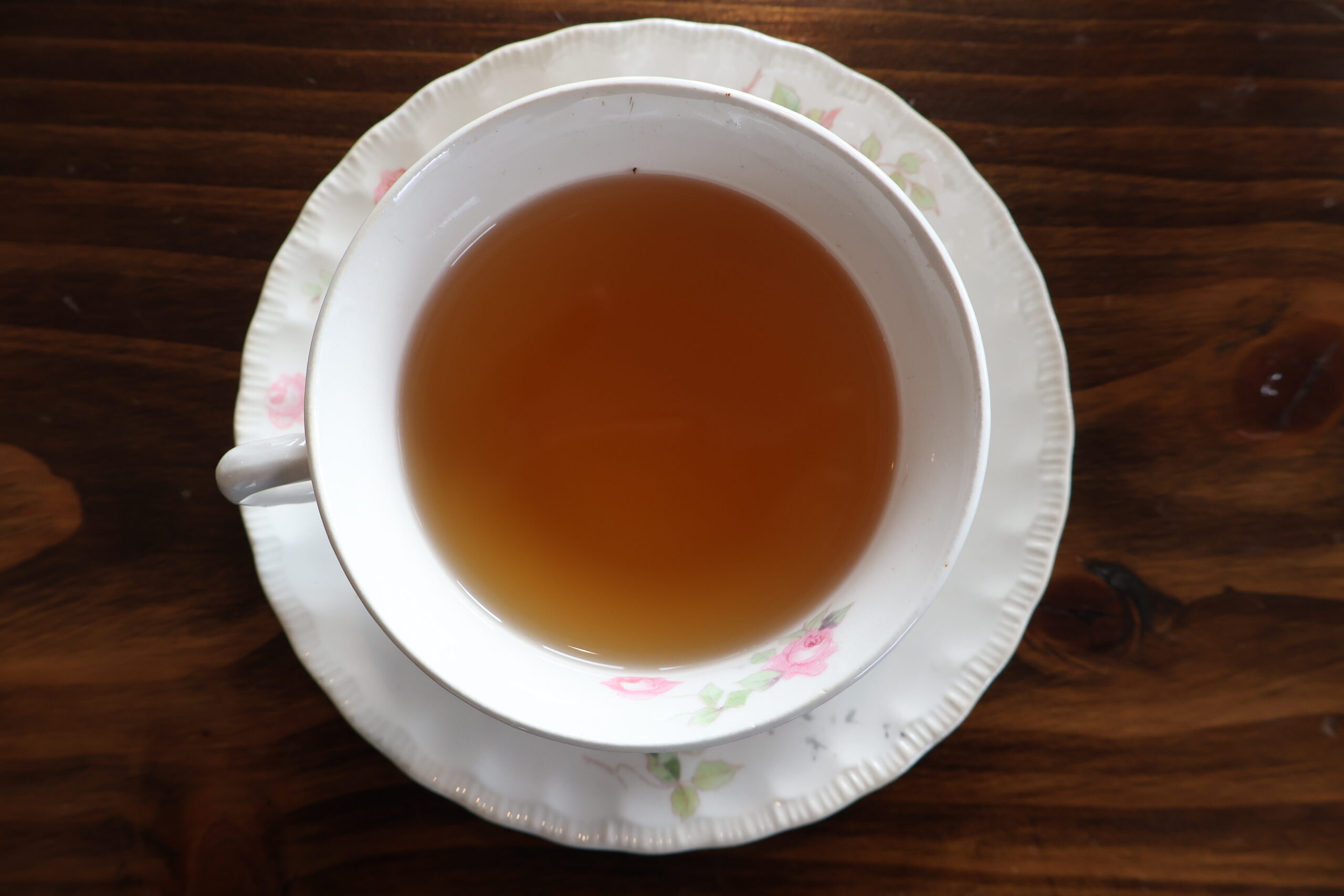 Full Tea Cup on wooden table